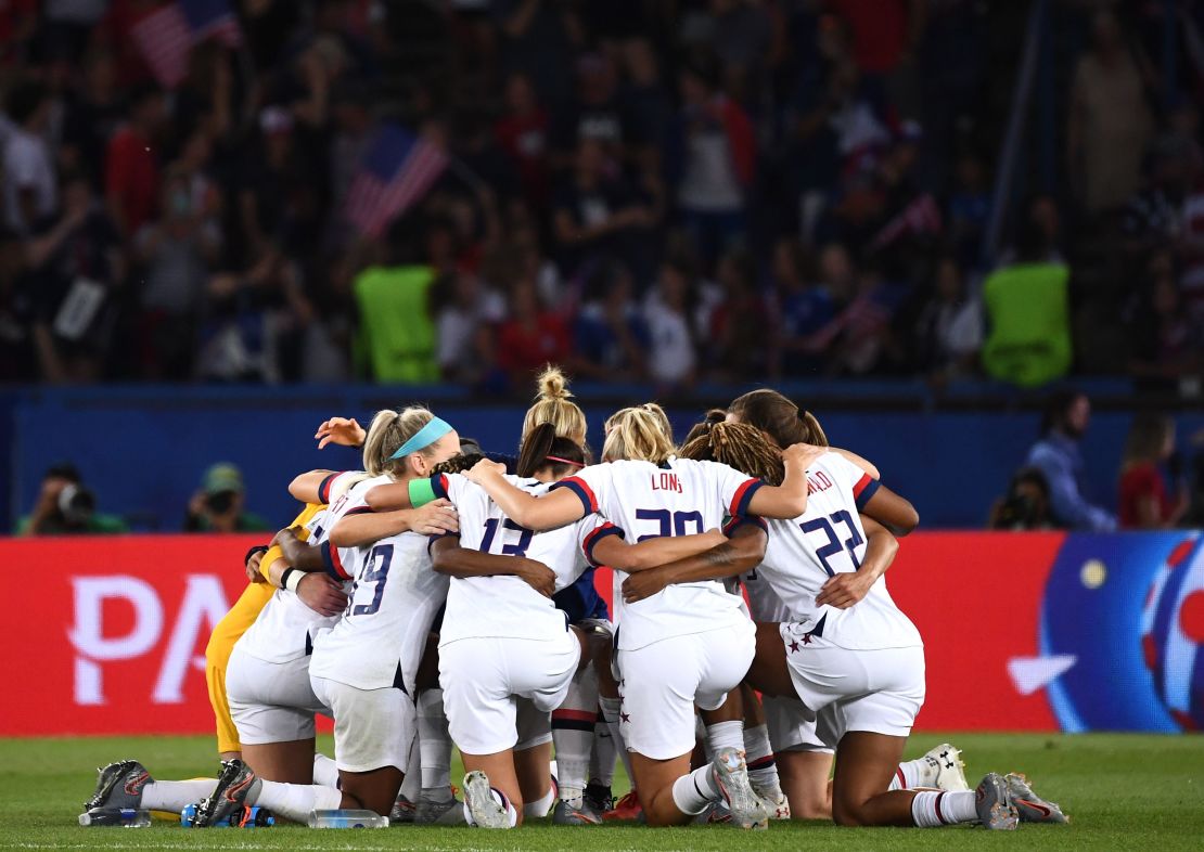US players huddle at the end of the match. 