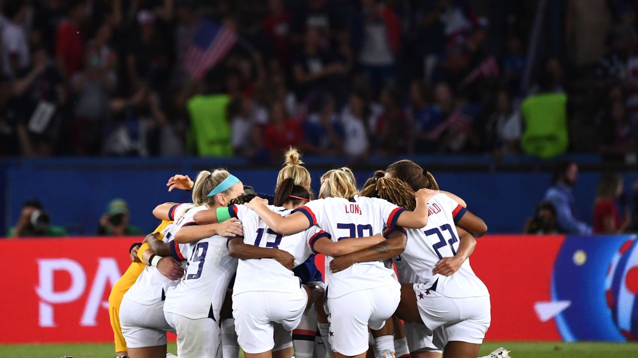 US players huddle at the end of the match. 