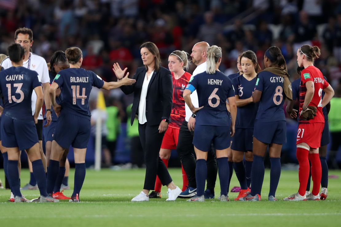 France coach Corinne Diacre consoled her side after the defeat. 