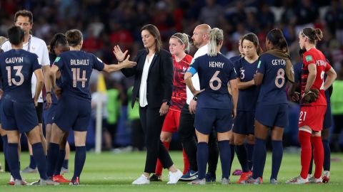 France coach Corinne Diacre consoled her side after the defeat.