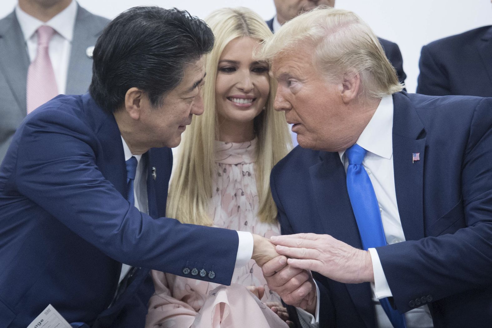 US President Donald Trump attends a meeting of G20 leaders to discuss women empowerment. He was joined by his daughter, Ivanka, and Japanese Prime Minister Shinzo Abe.