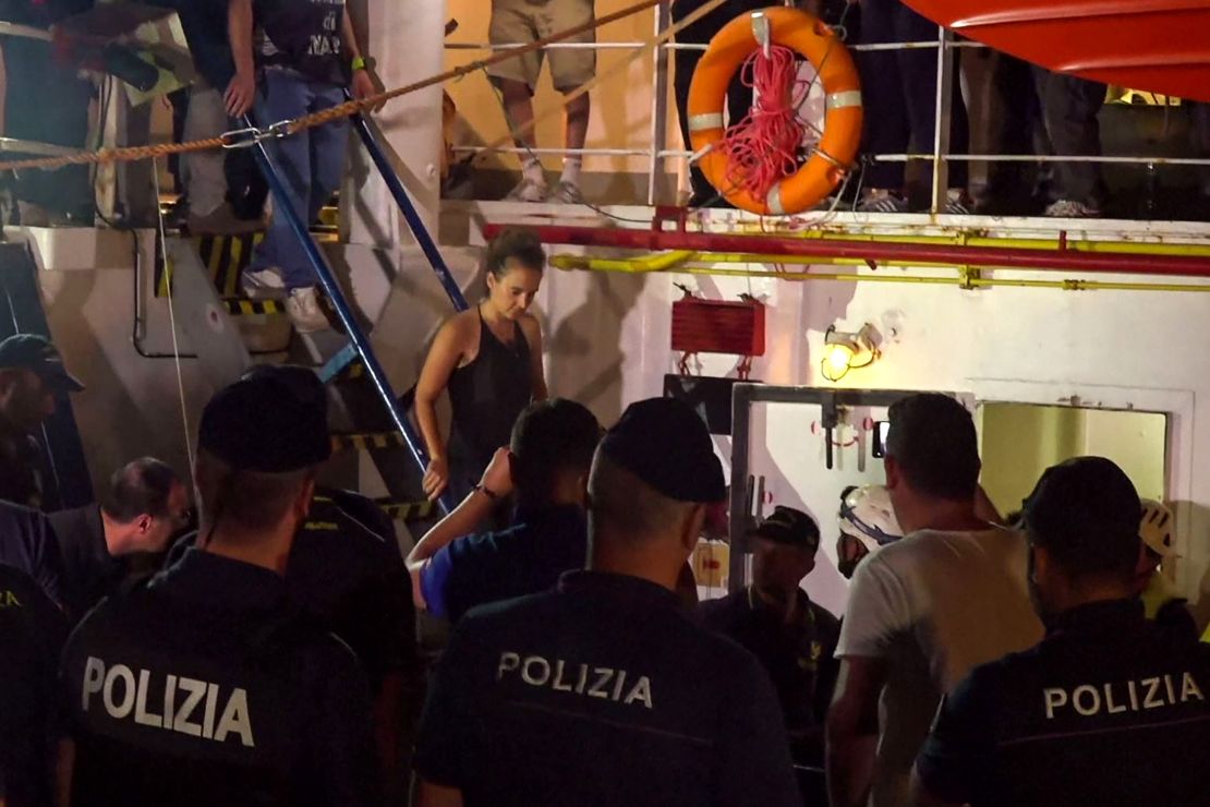 Carola Rackete is arrested after disembarking from the vessel.