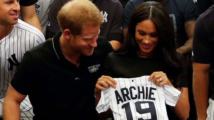 LONDON, ENGLAND - JUNE 29:   Prince Harry, Duke of Sussex and Meghan, Duchess of Sussex with a gift from the New York Yankees before their game against the  Boston Red Sox \at London Stadium on June 29, 2019 in London, England. The game is in support of the Invictus Games Foundation. (Photo by Peter Nicholls/WPA Pool/Getty Images)