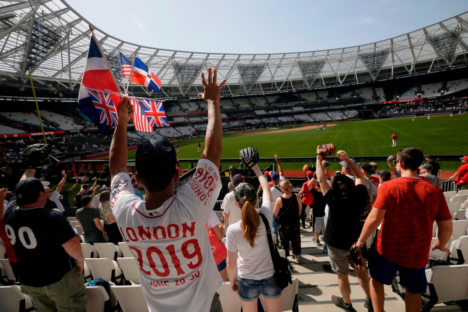 Fans cheer during batting practice prior to game one on June 29.