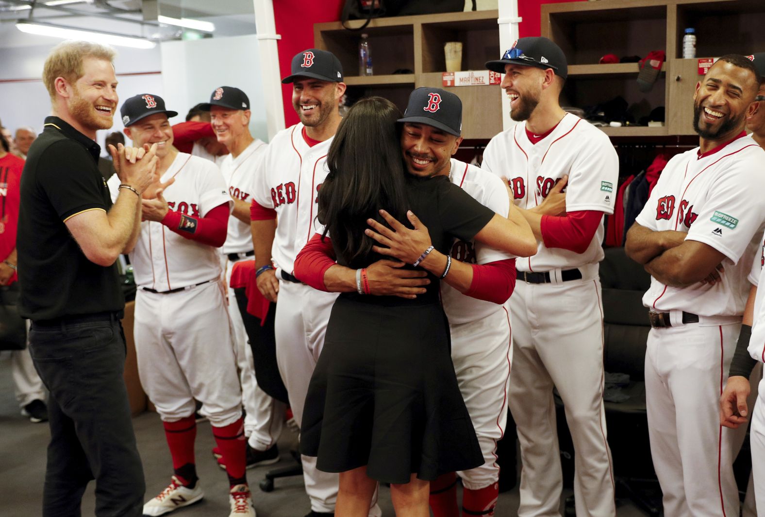 Meghan Markle, Duchess of Sussex, hugs Mookie Betts of the Boston Red Sox prior to game one of the London Series on June 29.