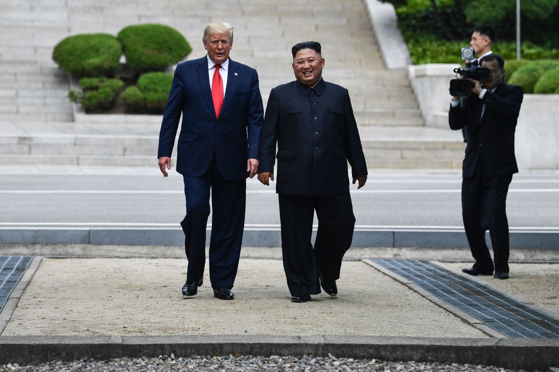 Kim Jong Un walks with  Donald Trump at the DMZ dividing the Koreas on June 30, 2019.