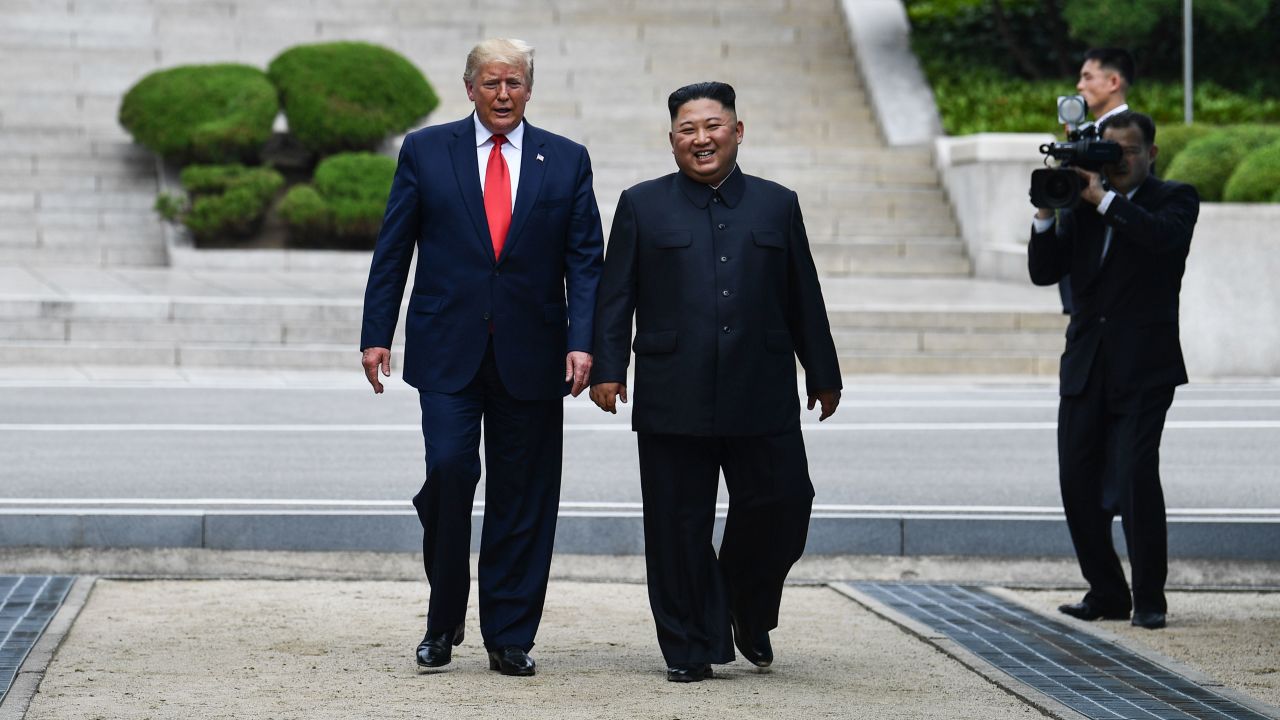 Kim Jong Un walks with  Donald Trump at the DMZ dividing the Koreas on June 30, 2019.
