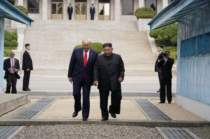After shaking hands and patting each other's backs while inside North Korean territory, the leaders walked together back across the line into South Korea.