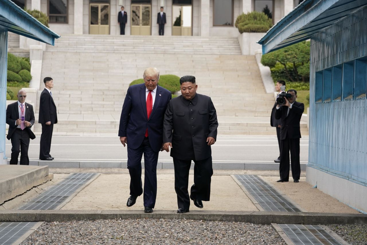 After shaking hands and patting each other's backs while inside North Korean territory, the leaders walked together back across the line into South Korea.