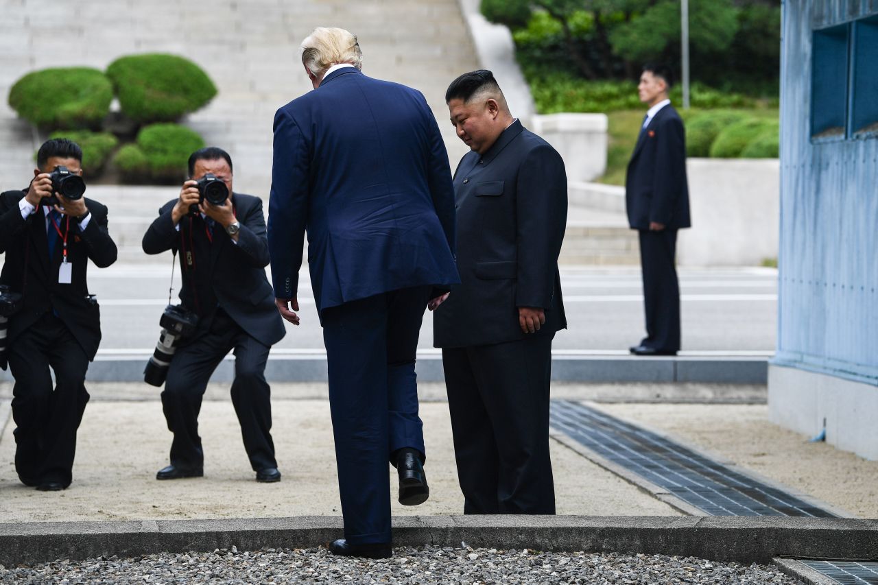 Trump makes history as he steps onto the northern side of the Military Demarcation Line that divides North and South Korea on June 30. Kim looks on as Trump becomes the first sitting US President to walk into South Korea.