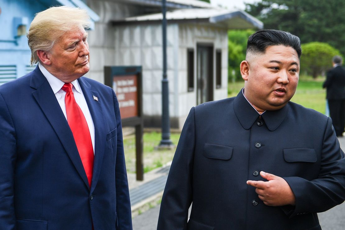 North Korea's leader Kim Jong Un speaks as he stands with US President Donald Trump south of the Military Demarcation Line that divides North and South Korea, in the Joint Security Area (JSA) of Panmunjom in the Demilitarized zone (DMZ) on June 30, 2019.