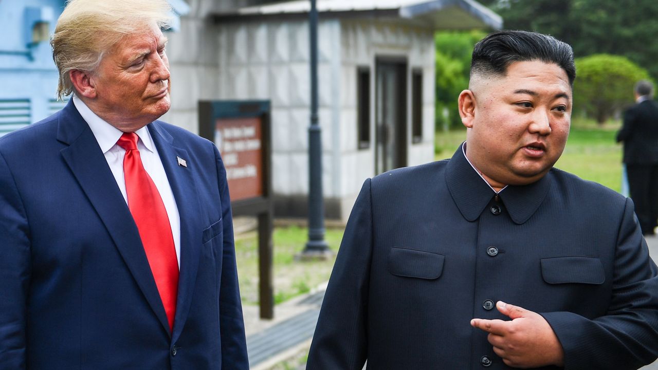 North Korea's leader Kim Jong Un speaks as he stands with US President Donald Trump south of the Military Demarcation Line that divides North and South Korea, in the Joint Security Area (JSA) of Panmunjom in the Demilitarized zone (DMZ) on June 30, 2019.