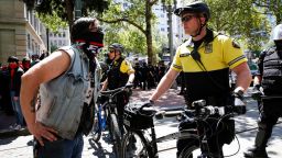 PORTLAND, OR - JUNE 29: An unidentified protester clashes with a police officer during a demonstration between the left and right at Pioneer Courthouse Square on June 29, 2019 in Portland, Oregon. Several groups from the left and right clashed after competing demonstrations at Pioneer Square, Chapman Square, and Waterfront Park spilled into the streets. According to police, medics treated eight people and three people were arrested during the demonstrations. (Photo by Moriah Ratner/Getty Images)