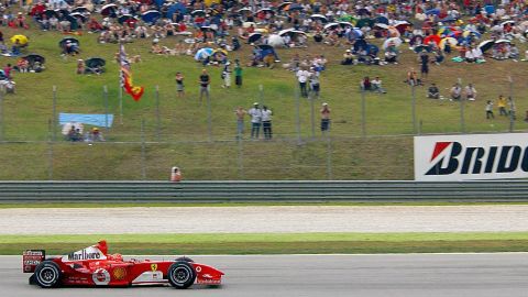 Michael Schumacher rides his F2004 to victory at the Malaysian Grand Prix in 2004. 