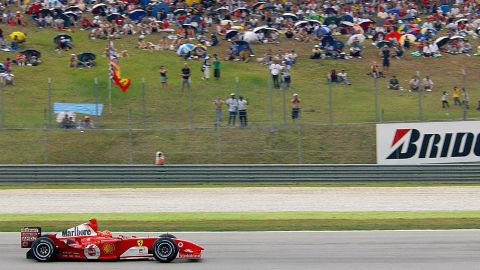 Michael Schumacher rides his F2004 to victory at the Malaysian Grand Prix in 2004.