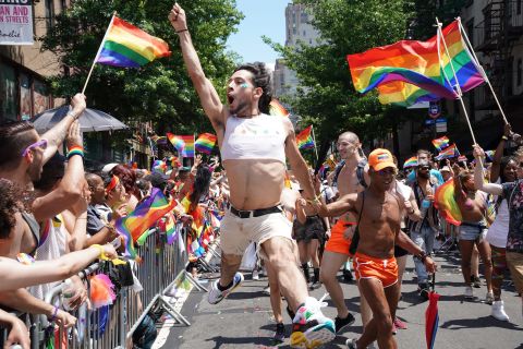 An exuberant marcher leaps in the air during the New York City Pride March.