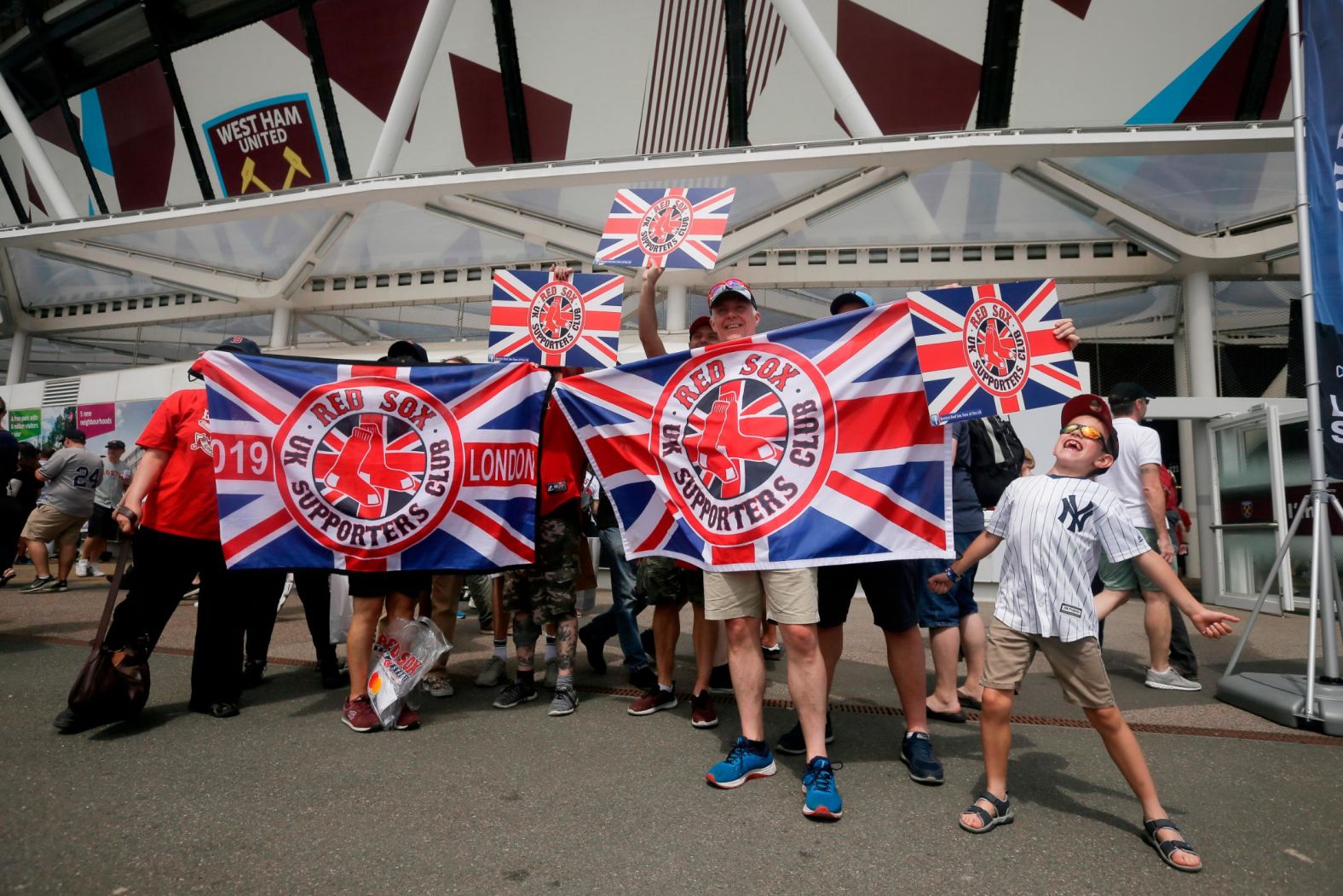 Fans pose for a picture outside London Stadium on June 30.