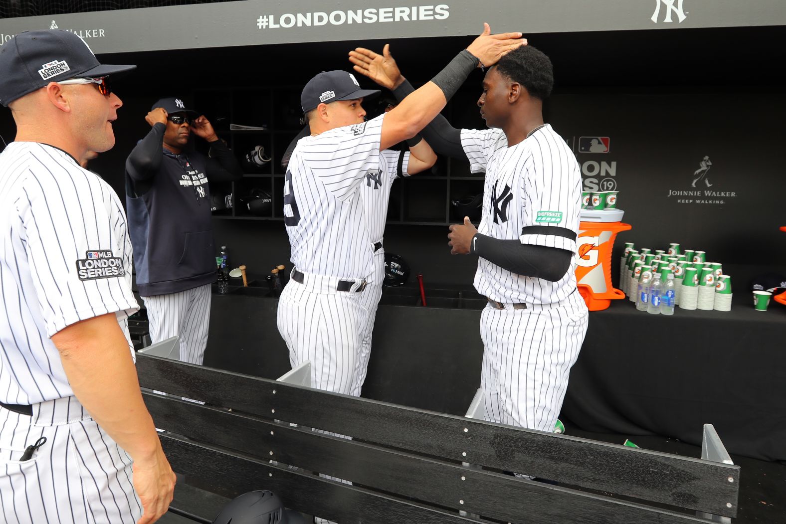 Gio Urshela and Didi Gregorius of the New York Yankees share an elaborate handshake on June 30.