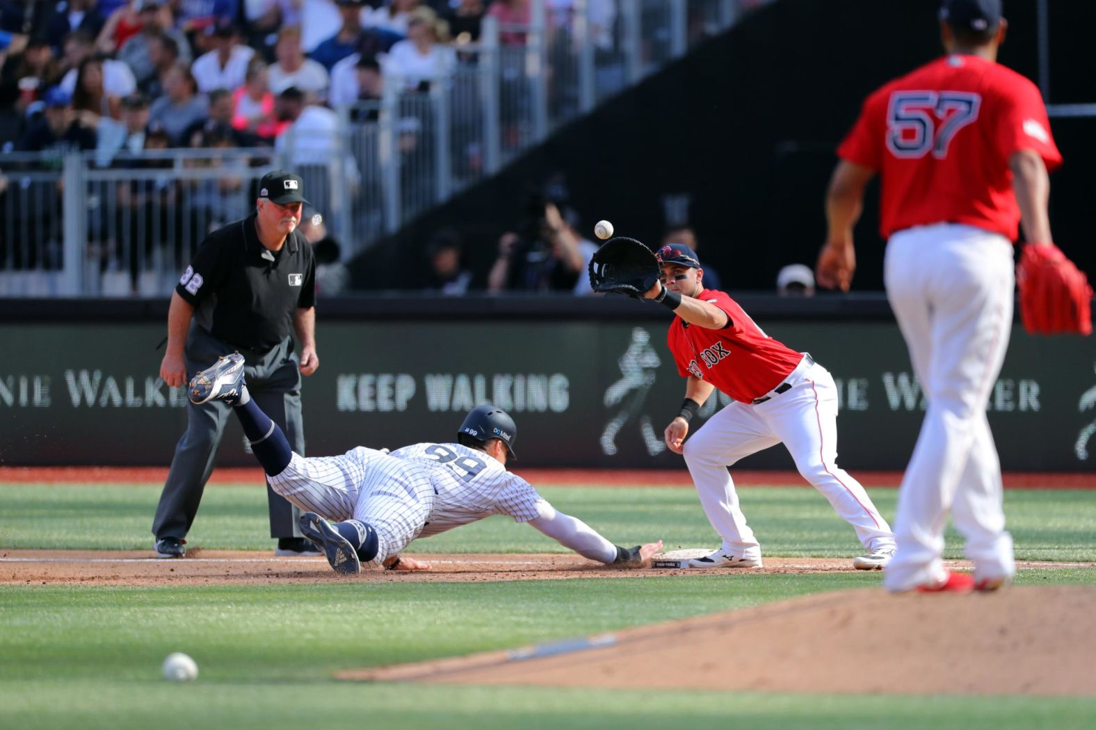 New York Yankees right fielder Aaron Judge dives back to first during the game on June 30.