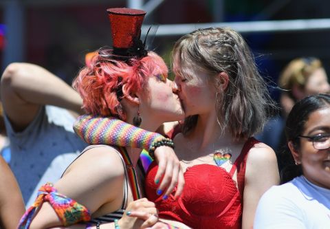 A couple kisses during the march.