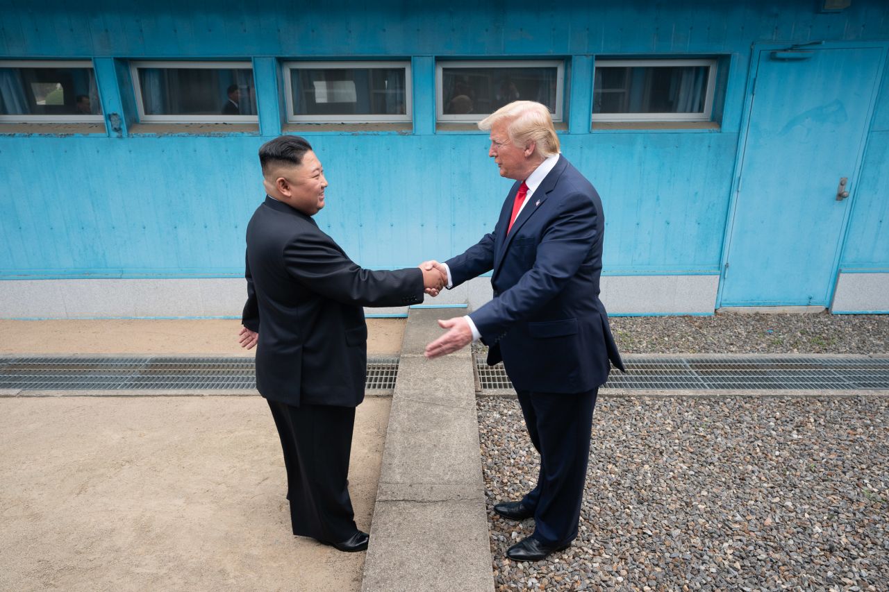 Trump shakes hands with North Korean leader Kim Jong Un as the two <a href="https://www.cnn.com/2019/06/30/world/gallery/trump-kim-north-korea/index.html" target="_blank">meet at the Korean Demilitarized Zone</a> in June 2019. Trump briefly stepped over into North Korean territory, becoming the first sitting US leader to set foot in the nation. Trump said he invited Kim to the White House, and both leaders agreed to restart talks after nuclear negotiations stalled.