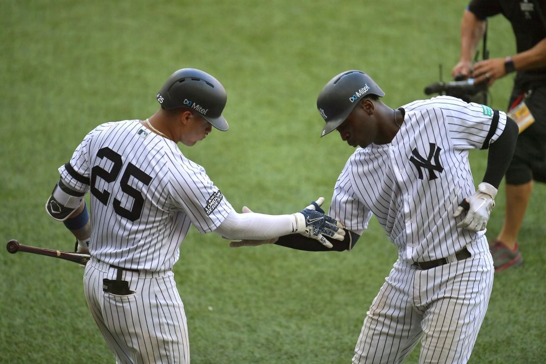 Didi Gregorius of the New York Yankees (R) celebrates his home run with teammate Gleyber Torres on Sunday. The Yankees defeated the Red Sox in both games of their London visit.