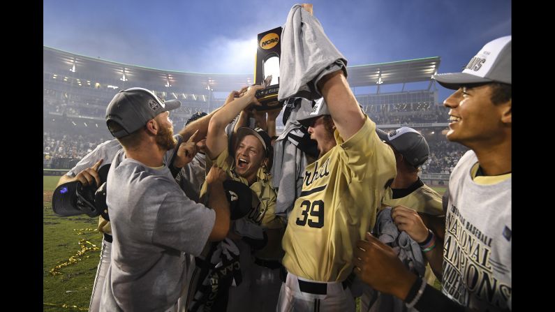 The Vanderbilt Commodores celebrate with the national championship trophy after defeating the Michigan Wolverines to win the Division I Men's Baseball Championship in Omaha, Nebraska, on June 26.