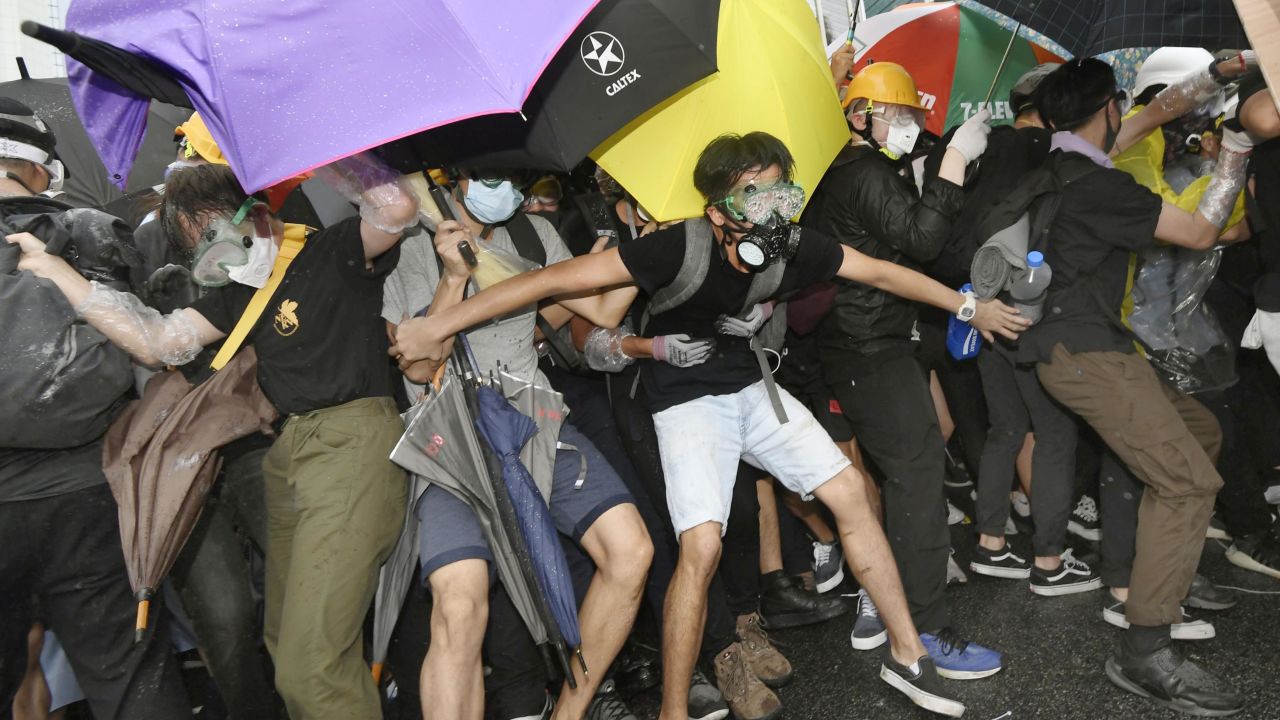 Protesters opposing Hong Kong's now suspended extradition bill face off police on July 1, 2019, near the venue in the central part of the territory of a ceremony the same day to mark the 22nd anniversary of the former British colony's handover to China.