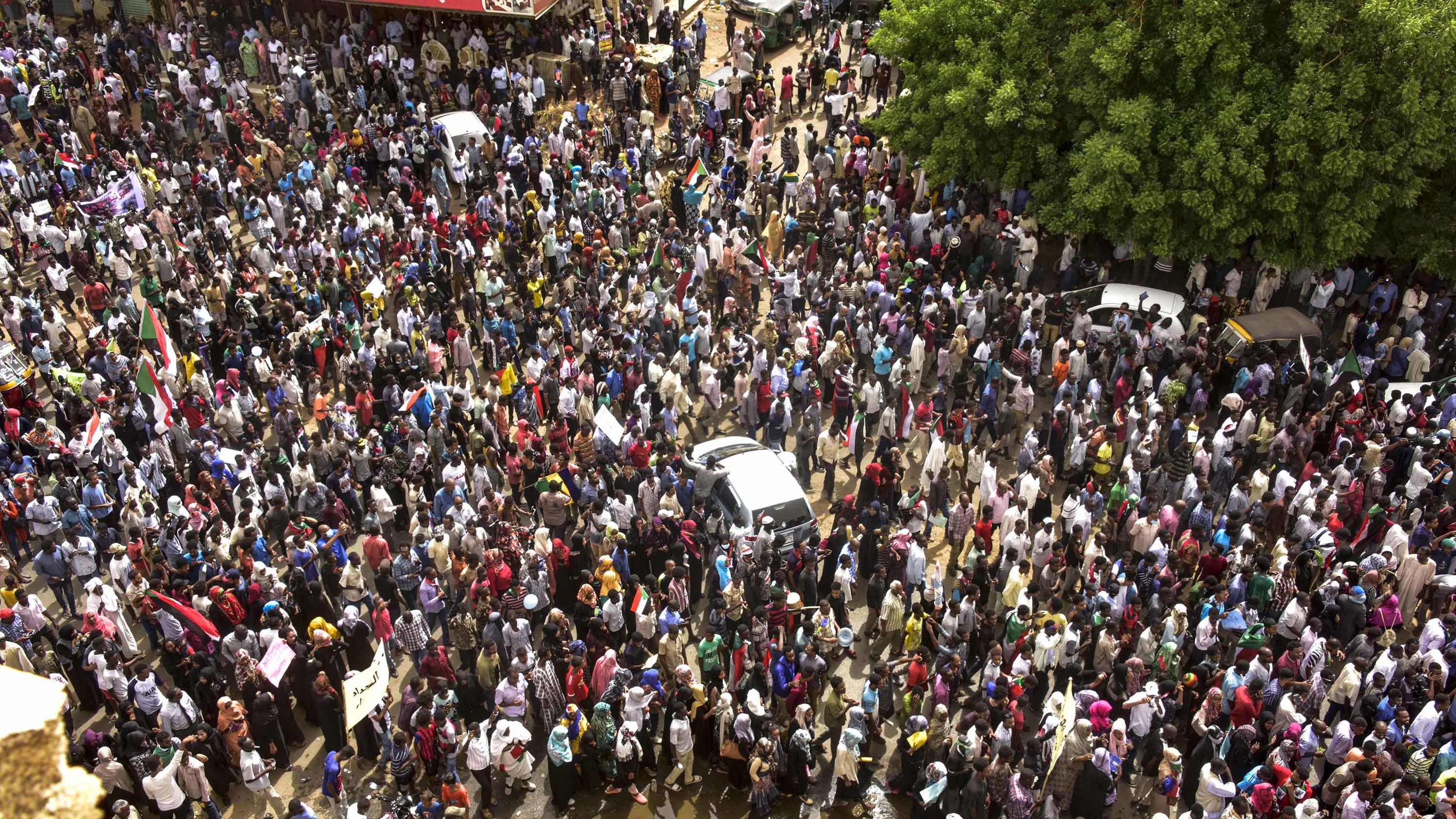 Sudanese protesters march in a mass demonstration against the country's ruling generals in the capital's twin city of Omdurman on June 30.