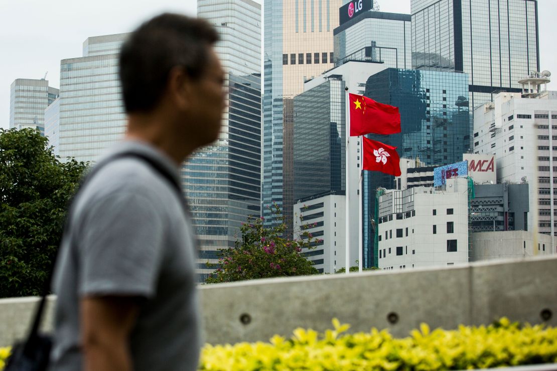 The Chinese and Hong Kong flags are seen outside the Legislative Council in Hong Kong on November 4, 2017. 
