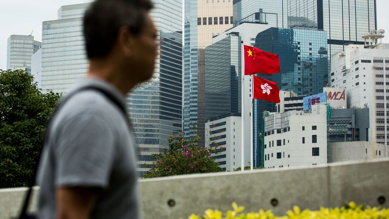 The Chinese and Hong Kong flags are seen outside the Legislative Council in Hong Kong on November 4, 2017. 
