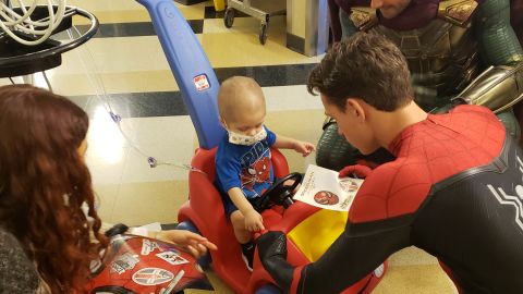 Zendaya and Tom Holland with a young patient