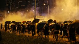 Mandatory Credit: Photo by JEROME FAVRE/EPA-EFE/Shutterstock (10325661d)
Protesters run after police fire tear gas outside the Legislative Council Building in Hong Kong, China, 02 July 2019. Hundreds of protesters broke into the Legislative Council Building on 01 July 2019 on the 22nd anniversary of the 1997 transfer of sovereignty of Hong Kong from Britain to China.
Annual pro-democracy rally in Hong Kong, China - 02 Jul 2019