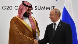 Russia's President Vladimir Putin (R) shakes hands with Saudi Arabia's Crown Prince Mohammed bin Salman during a meeting on the sidelines of the G20 Summit in Osaka on June 29, 2019. (Photo by Yuri KADOBNOV / POOL / AFP)        (Photo credit should read YURI KADOBNOV/AFP/Getty Images)