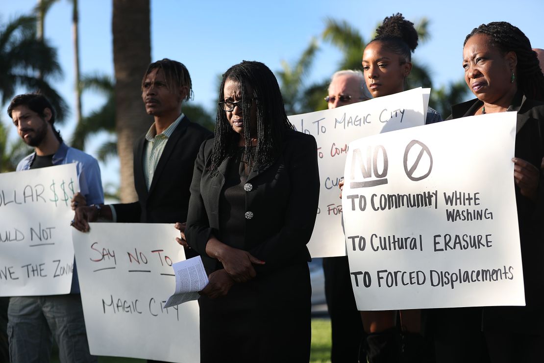 Marleine Bastien, center, protests with residents and activists against the Magic City plans.  