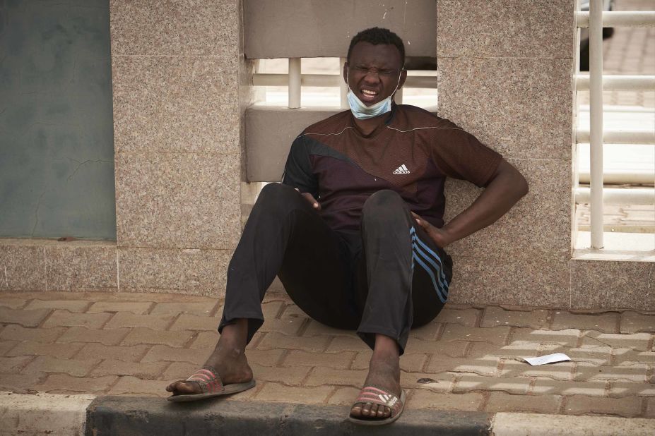 A protester reacts to tear gas on June 30.