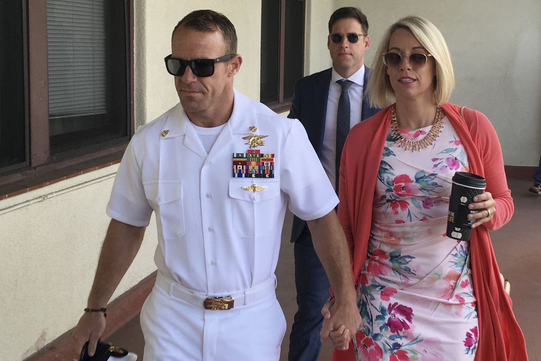 Navy Special Operations Chief Edward Gallagher, left, and his wife, Andrea Gallagher arrive at military court Monday.