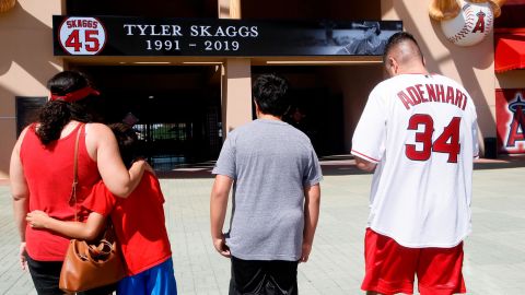 Ben Villa, his wife, Cindy, left, with their sons' Alex, second from left, and Benji give their condolences for pitcher Tyler Skaggs at Angel Stadium.