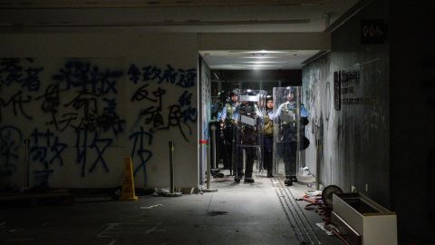 Police arrive after protesters stormed the government headquarters hours before in Hong Kong early on July 2, 2019.