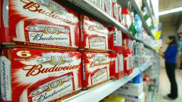 SHANGHAI, CHINA:  Packs of US brand Budweiser beers are displayed in a Shanghai's supermarket, 20 October 2004.  US-based Anheuser-Busch, the world's largest brewer and the maker of Budweiser, may pay up to one billion dollars for a stake in China's Henan Jinxing Beer Group, an official with the Chinese brewer said.  AFP PHOTO/LIU Jin  (Photo credit should read LIU JIN/AFP/Getty Images)