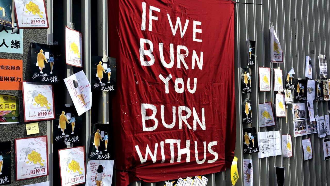 A flag reading "If we burn, you burn with us," erected outside Hong Kong's legislature on July 1, 2019.
