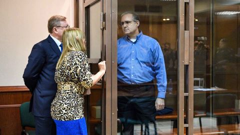 Paul Whelan, a former US Marine accused of espionage and arrested in Russia, listens to his lawyers while standing inside a defendants' cage during a hearing at a court in Moscow on January 22, 2019. (Photo by Mladen ANTONOV / AFP)   