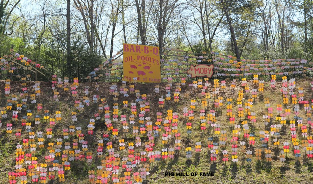 <strong>Poole's Bar-B-Q: </strong>At Poole's Bar-B-Q in East Ellijay, Georgia, motorists driving by on the Appalachian Highway can see hundreds of plywood pigs bearing names on the hillside behind the restaurant.