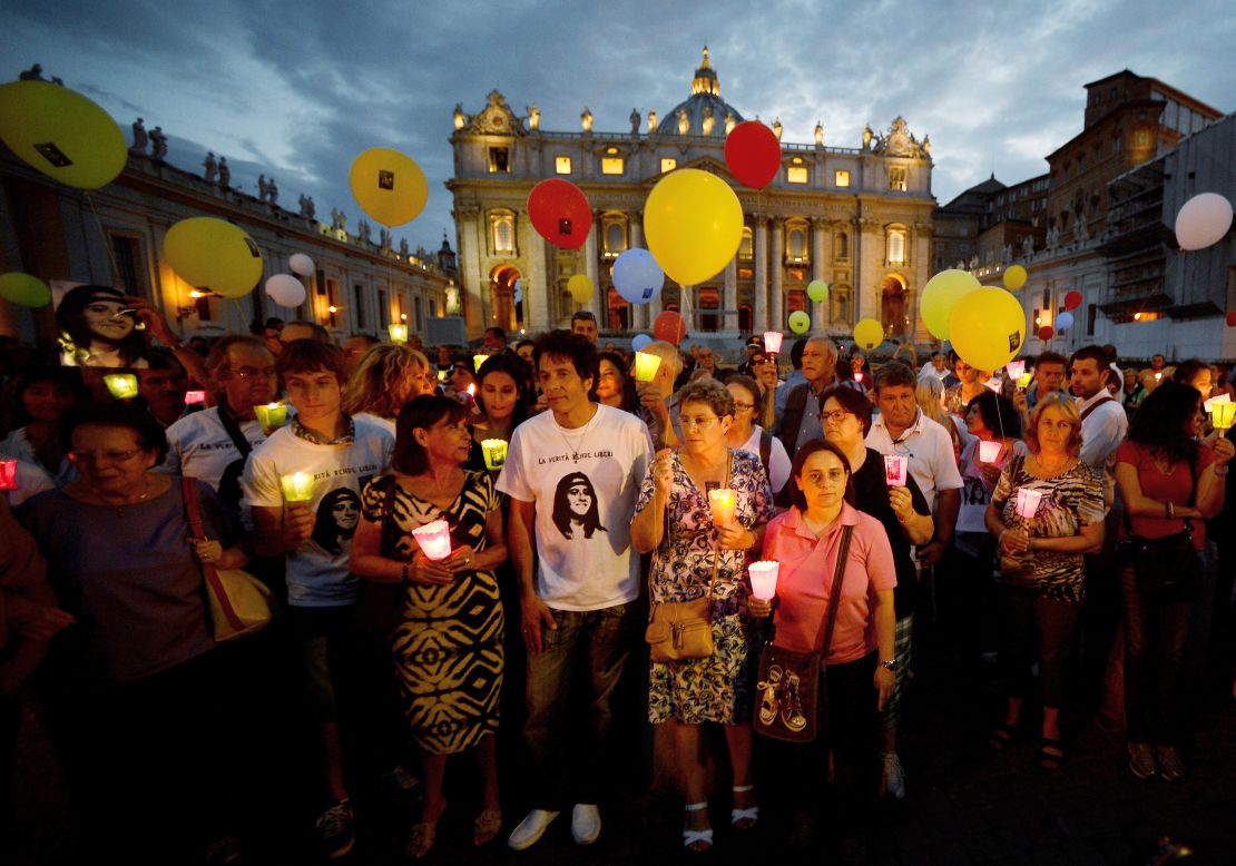 Demonstrators gather around Pietro Orlandi during a commemoration ceremony in 2013 marking the 30th anniversary of his sister's disappearance.