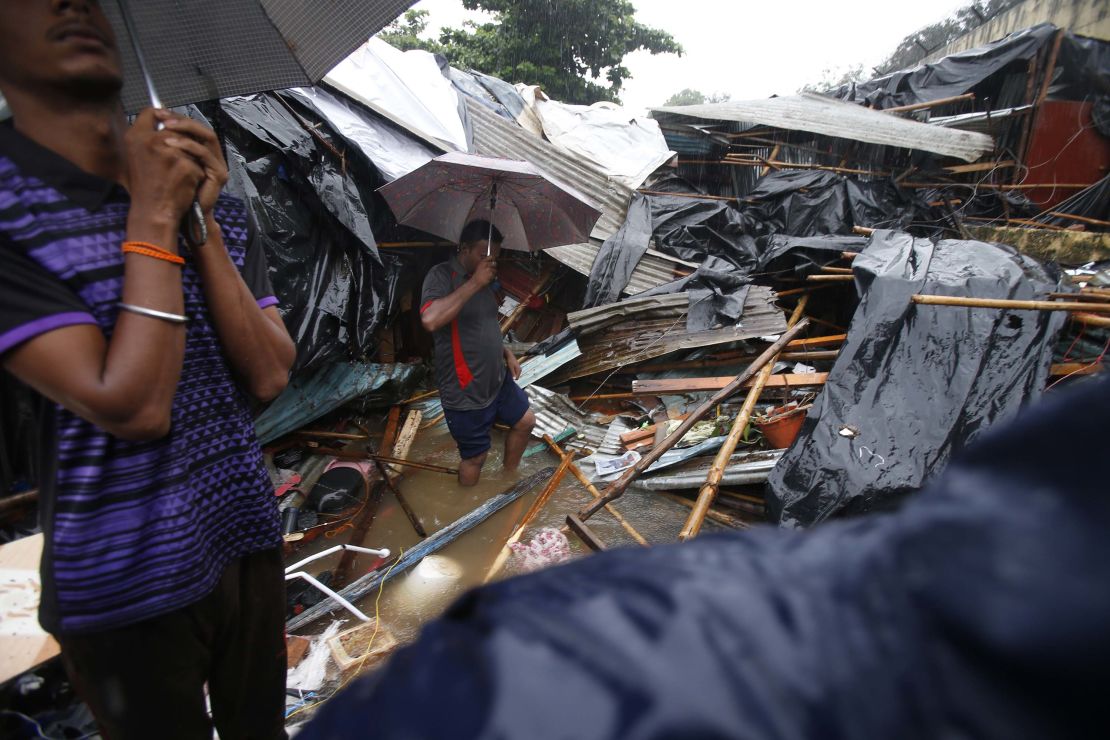 Shanty homes lay in ruins on Tuesday after a wall collapsed on them in Mumbai.