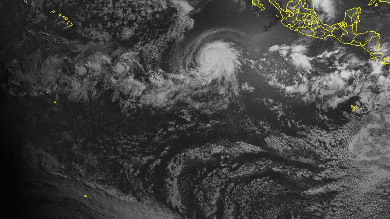 Satellite images show a total solar eclipse the moment it passed over a hurricane.