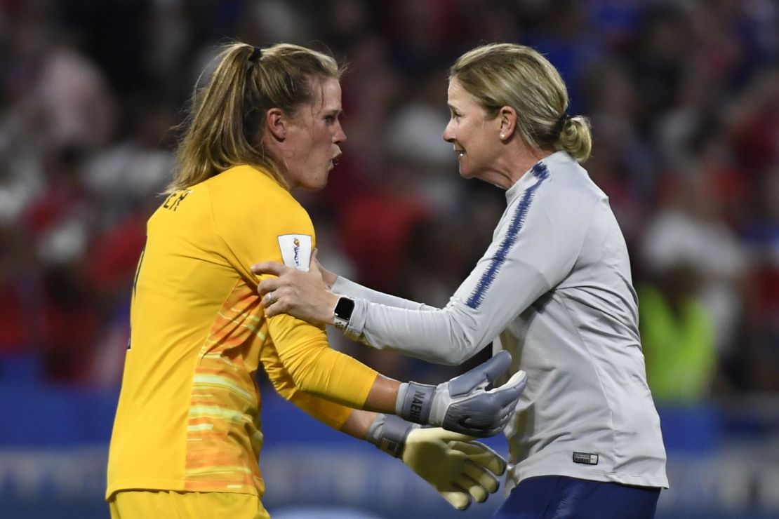 Ellis celebrates with goalkeeper Alyssa Naeher after the semifinal against England.