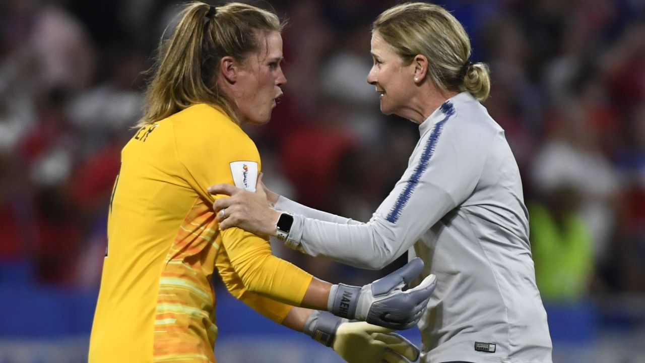 Ellis celebrates with goalkeeper Alyssa Naeher after the semifinal against England.