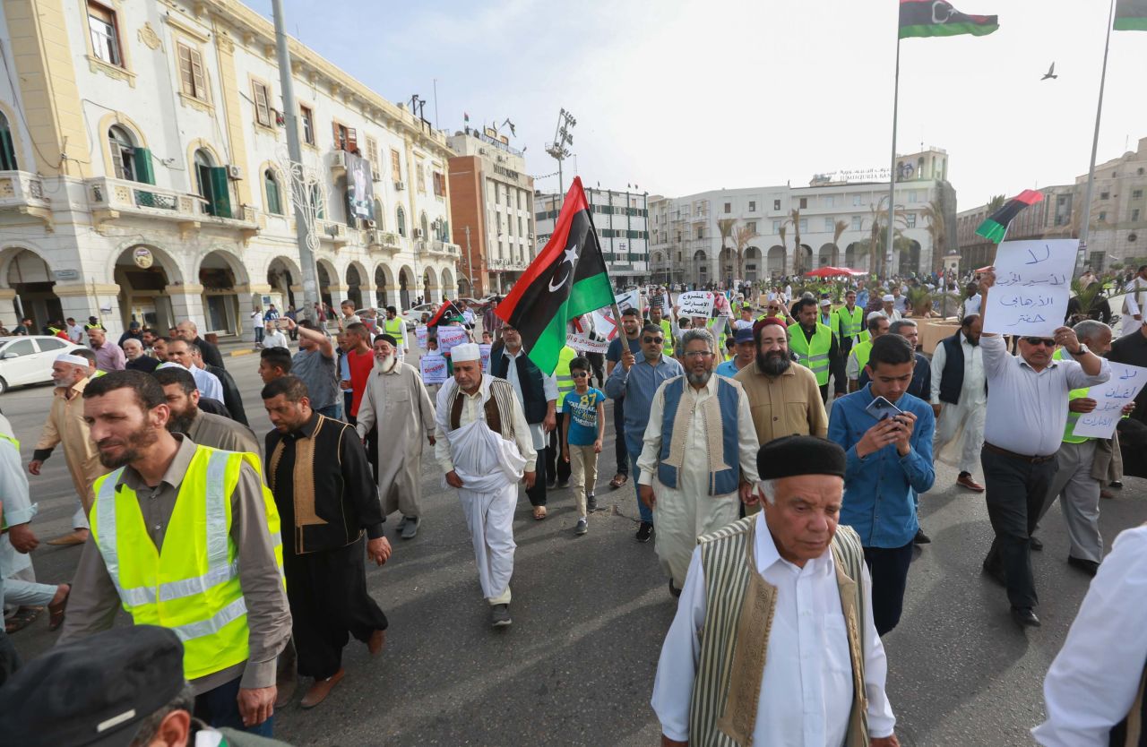 Libyans call for an end to fighting during a demonstration against Haftar in Tripoli's Martyrs Square on May 3.