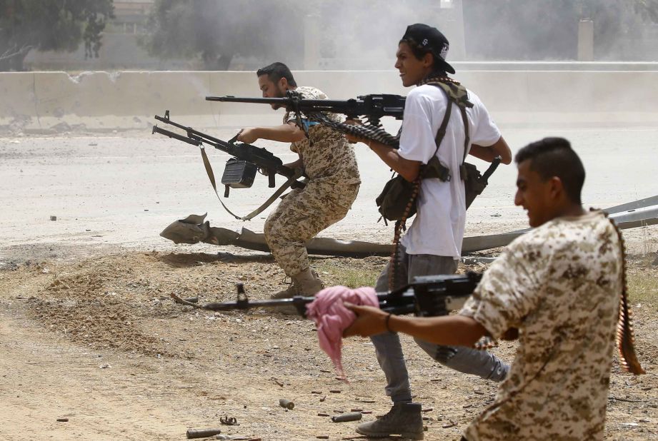 Government of National Accord fighters open fire from their position in the al-Sawani area south of Tripoli during clashes with forces loyal to Haftar on June 13.